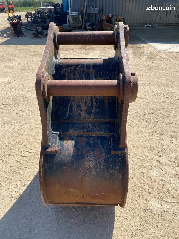 Godet de terrassement à axes