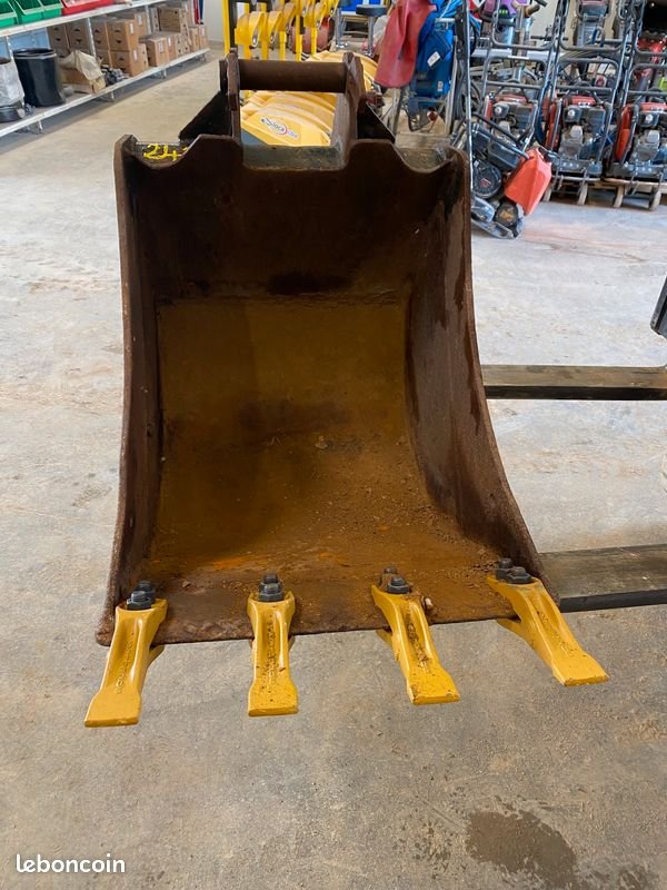 Godet de terrassement à axes