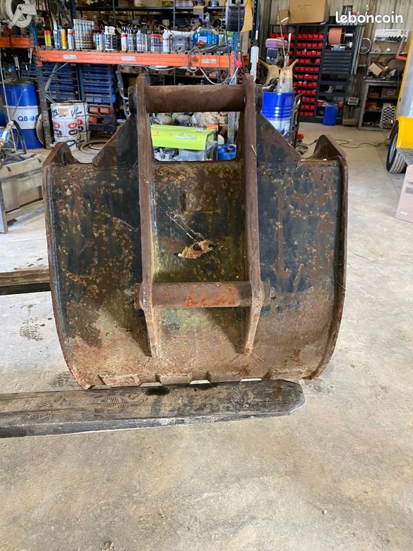 Godet de terrassement à axes