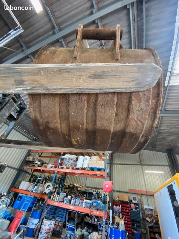 Godet de terrassement à axes